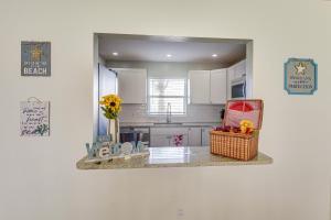 Coastal Condo Escape with Patio Steps to Beach