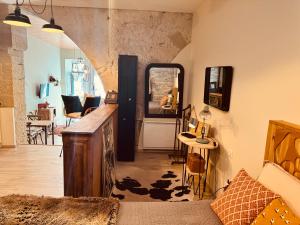 Appartements La Tannerie, centre historique, fibre, ESS, rez-de-chaussee, BedinShop : photos des chambres