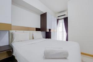 Warm and Nice 2BR Apartment at M-Town Residence By Travelio