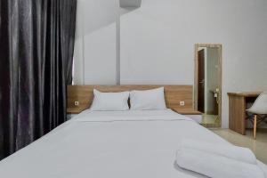 Restful and Modern 2BR Majestic Point Serpong Apartment By Travelio