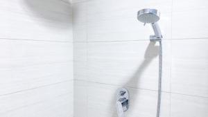 Fancy and Comfortable 1BR at Ciputra International Apartment By Travelio