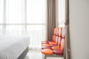 Fancy and Comfortable 1BR at Ciputra International Apartment By Travelio