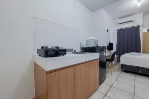 Homey and Elegant Studio Apartment M-Town Residence By Travelio