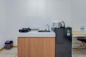 Homey and Elegant Studio Apartment M-Town Residence By Travelio