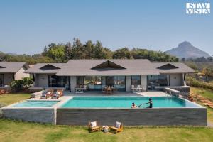 StayVista at Chitrakoot with Pool & Lawn