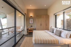 StayVista at Chitrakoot with Pool & Lawn