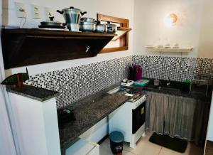 Flat Oxóssi cond beira-mar piscina varanda cozinha