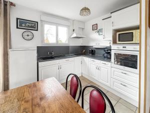 Maisons de vacances Maison cosy avec grand jardin : photos des chambres