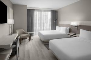 Corner Queen Room with Two Queen Beds room in AC Hotel St. Louis Clayton