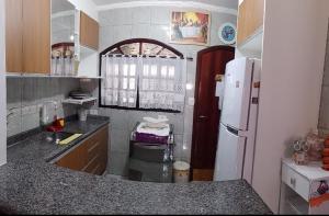 Casa Cond Fechado Aconchegante em Praia Grande e Wi-Fi