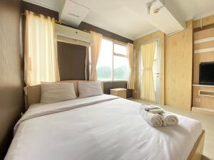 Spacious and Serene Studio Room Apartment at Jarrdin Cihampelas By Travelio