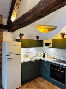 Appartements Maison des Conques : photos des chambres