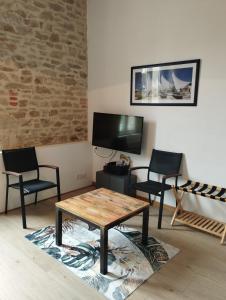 Appartements studio moderne les pieds dans l-eau : photos des chambres
