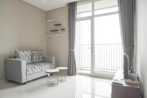 Nice and Fancy 1BR at Ciputra International Apartment By Travelio