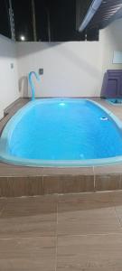 Casa com piscina e churrasqueira para família