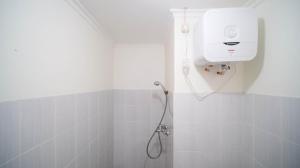 Cozy Living and Tidy 2BR at Puncak Dharmahusada Apartment By Travelio