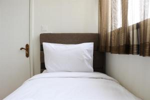 Homey and Comfort Living 2BR at Daan Mogot City Apartment By Travelio