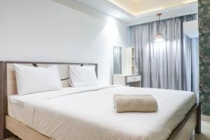 Vibrant Luxurious 1BR Apartment at La Riz Supermall Mansion By Travelio