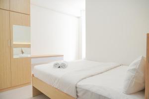 Comfy and Homey 2BR Transpark Cibubur Apartment By Travelio