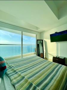 1PE-AL Apartamento de 1 alcoba frente al mar con Aire acondicionado, Piscina y Wifi