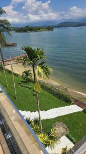 Angra dos Reis casa linear 5 suítes na beira da praia, piscina, churrasqueira, varanda ampla de frente pro mar