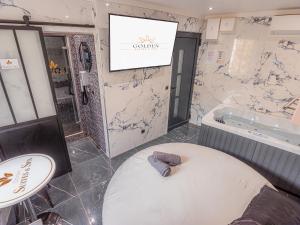 Maisons d'hotes Le Saphir Spa & Jacuzzi : photos des chambres