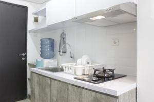 Modern Look Studio Apartment at Grand Asia Afrika By Travelio