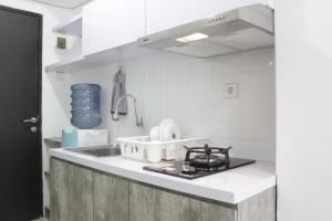 Modern Look Studio Apartment at Grand Asia Afrika By Travelio