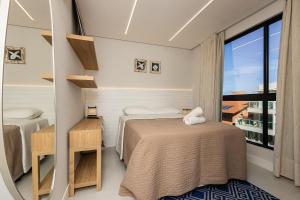 Di Ravena 101 - Apartamento Moderno em Canto Grande a 120 Metros do Mar.