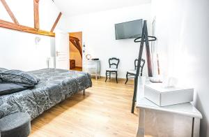 Maisons de vacances Chez Louis le Tonnelier, Sauna et espace detente prives : photos des chambres