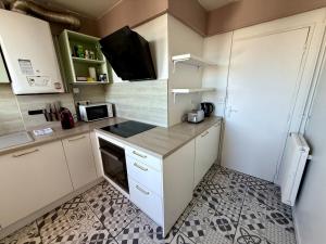 Appartements Appartement au pied du metro. : photos des chambres