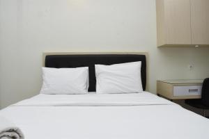 Elegant and Nice Studio at Evenciio Margonda Apartment By Travelio