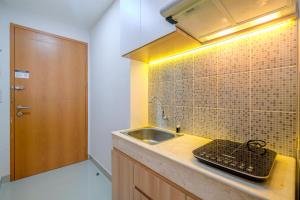 Good Deal Studio at Evenciio Apartment Margonda near UI By Travelio