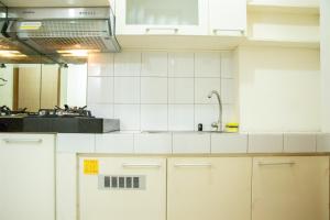 Homey and Cozy Stay Studio at Margonda Residence 2 Apartment By Travelio