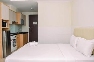 Fancy and Nice Studio Room at Menteng Park Apartment By Travelio