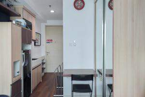 Nice and Elegant Studio at Tree Park City BSD Apartment By Travelio