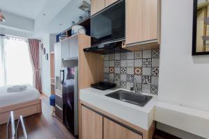 Nice and Elegant Studio at Tree Park City BSD Apartment By Travelio