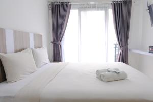 Best Deal Studio at Grand Asia Afrika Apartment By Travelio