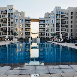 Lovely calm 3BR Apt Easy Accessibility to central Dubai with huge balcony and pool view Town Square