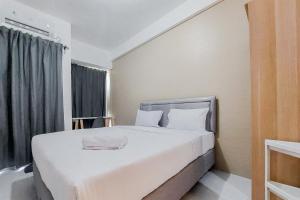 Homey and Cozy Studio Akasa Pure Living BSD Apartment By Travelio