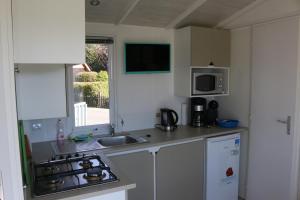 Mobilheim Wattwurm mit Veranda am Kransburger See 555