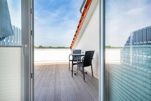 Ferienwohnung Flut mit Loggia und schönem Ausblick am Badesee Tannenhausen