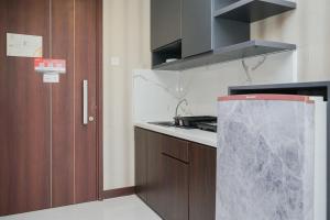 Cozy Design 1BR Apartment at Scientia Residence By Travelio