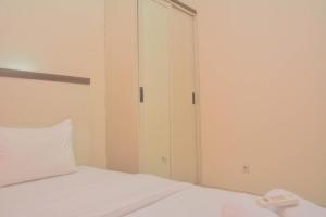 Comfy and Best Deal 2BR at Green Pramuka City Apartment By Travelio