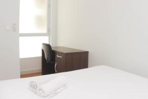 Homey and Minimalist 2BR at Patraland Urbano Apartment By Travelio