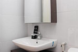 Homey and Minimalist 2BR at Patraland Urbano Apartment By Travelio