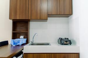 Good Deal 1BR Apartment M-Town Residence near SMS By Travelio