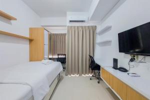 Restful and Cozy Studio at Serpong Garden Apartment By Travelio