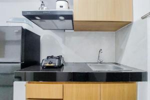Restful and Cozy Studio at Serpong Garden Apartment By Travelio