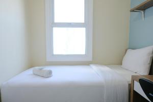 Homey and Comfy 2BR Apartment at Parahyangan Residence By Travelio